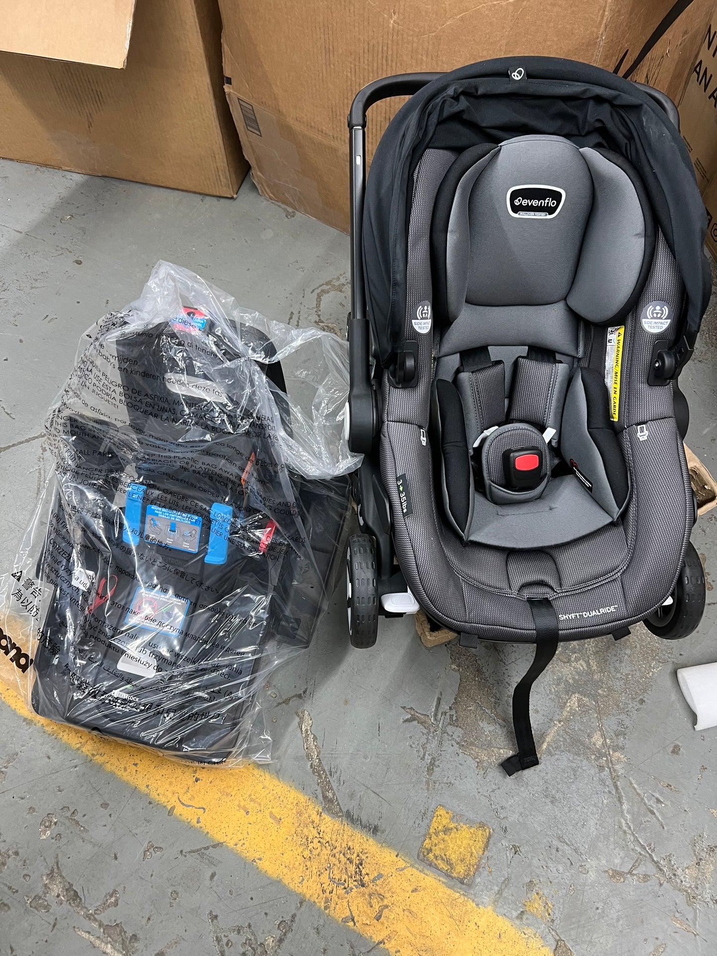 Evenflo Shyft DualRide with Carryall Storage infant car seat and stroller combo Travel System BOONE GRAY
